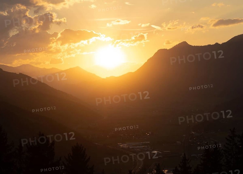 Sunset over the Liesingtal, in the evening light the village of Traboch, Schoberpass federal road, view from the lowlands, Leoben, Styria, Austria, Europe
