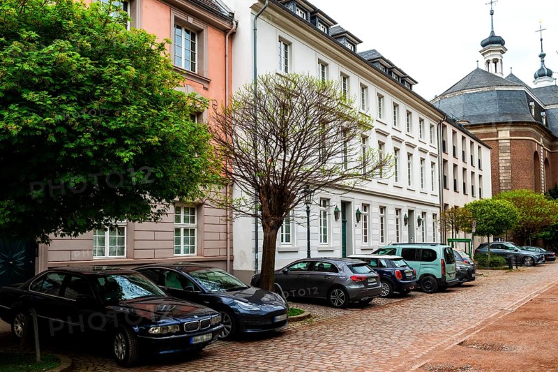 Row of houses on Orangeriestrasse, St Maximilian's Church at the back, Old Town, Duesseldorf, North Rhine-Westphalia, Germany, Europe