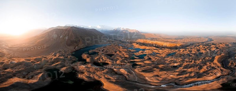 Atmospheric aerial view, high mountain landscape with glacier moraines and mountain lakes, behind Pik Lenin, Trans Alay Mountains, Pamir Mountains, Osher Province, Kyrgyzstan, Asia