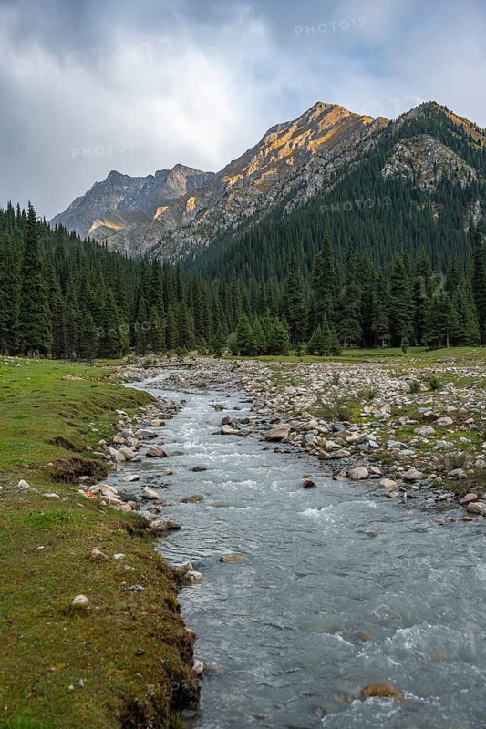 Green mountain valley with river and steep mountain peaks, Chong Kyzyl Suu Valley, Terskey Ala Too, Tien-Shan Mountains, Kyrgyzstan, Asia