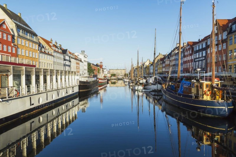 Moored Liva II restaurant boat, ships and colourful 17th century apartment buildings and houses along the Nyhavn canal, Copenhagen, Denmark, Europe