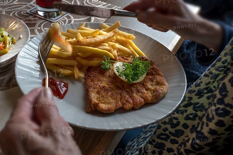Pork schnitzel with French fries served in a pub, Franconia, Bavaria, Germany, Europe