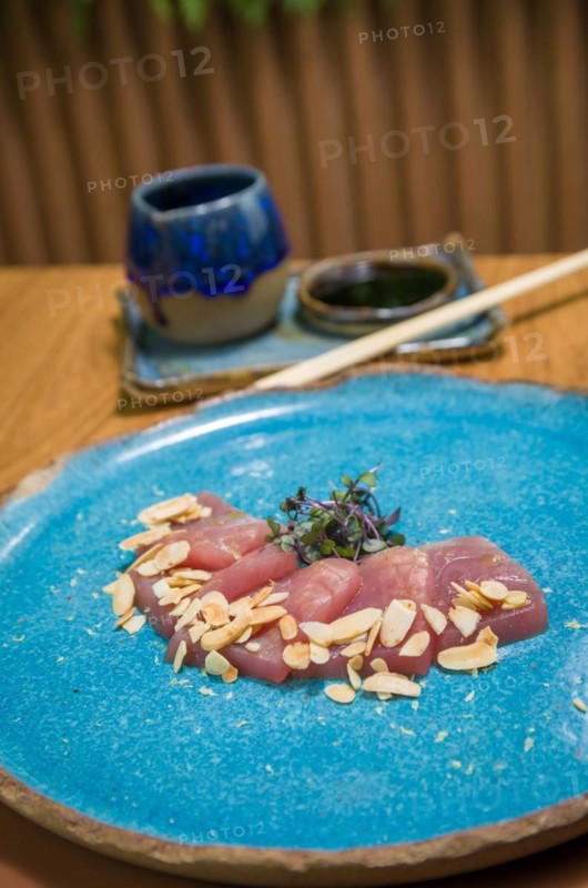 Delicious premium tuna sashimi arranged on an elegant handmade platter