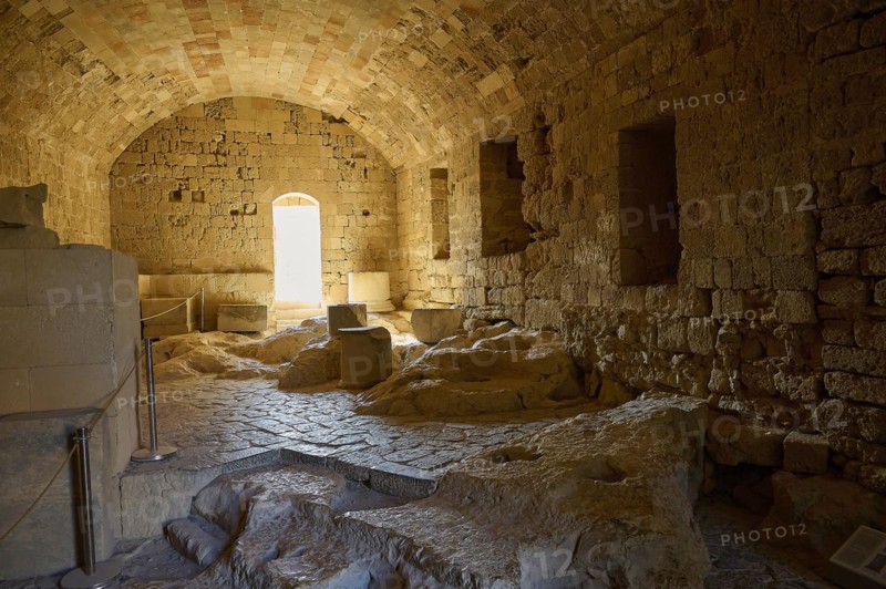 Knights' building, ground floor, interior of an old ruin with stone blocks and a vaulted ceiling, St John's Fortress, Lindos, Rhodes, Dodecanese, Greek Islands, Greece, Europe
