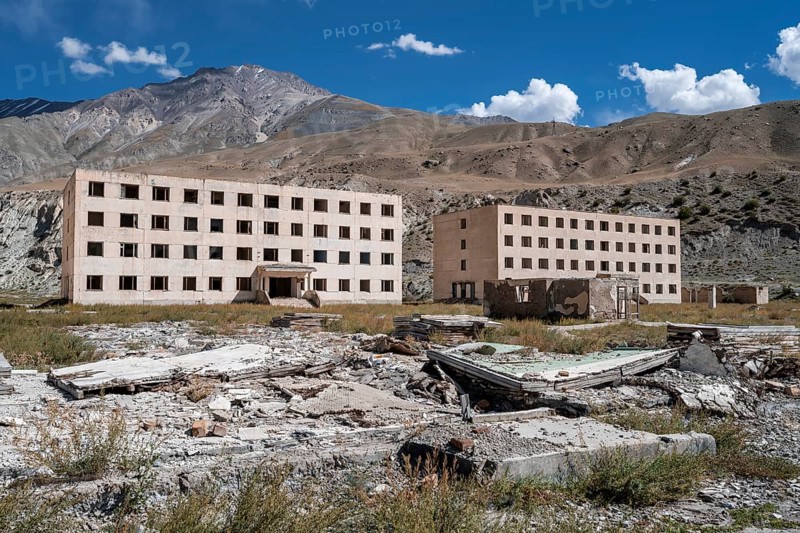 Abandoned, destroyed residential buildings, old Soviet apartment blocks in the ghost town, Engilchek, Tian Shan, Kyrgyzstan, Asia