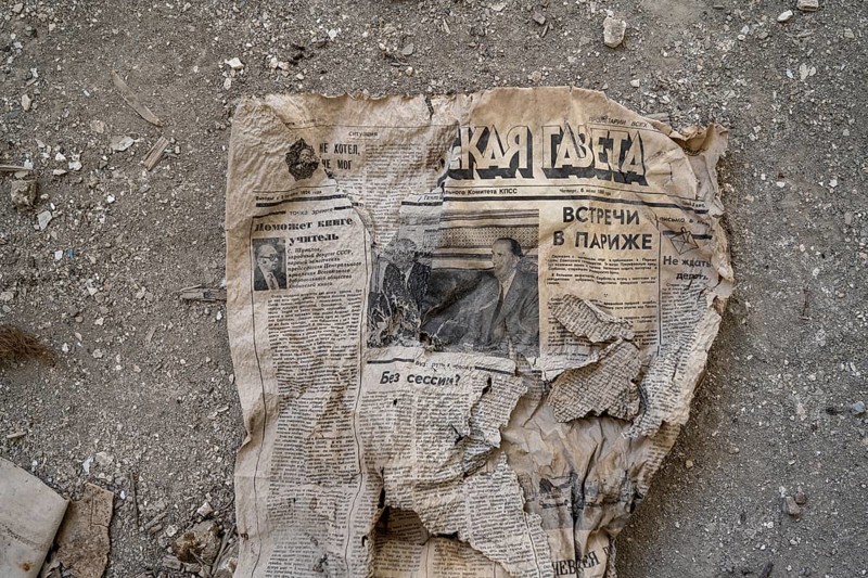 Remains of an old Kyrgyz newspaper from 1924 with Cyrillic writing in an abandoned building, ghost town, Engilchek, Tian Shan, Kyrgyzstan, Asia