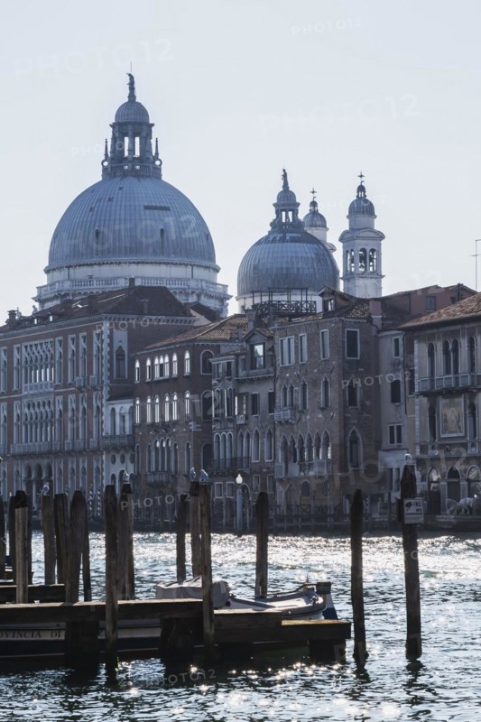 Silhouetted view of Grand canal and Santa Maria della Salute basilica with Renaissance architectural style palace buildings in Dorsoduro, Venice, Veneto, Italy, Europe