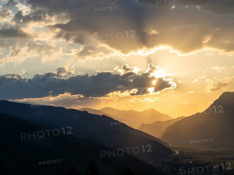 Sunset over the Liesingtal, in the evening light the village of Traboch, Schoberpass federal road, view from the lowlands, Leoben, Styria, Austria, Europe