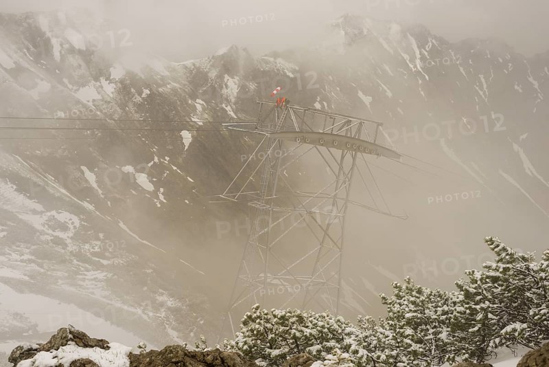 Cable car technicians working in bad weather conditions, Nebelhorn cable car near Oberstdorf, Allgaeu Alps, Allgaeu, Bavaria, Germany, Europe