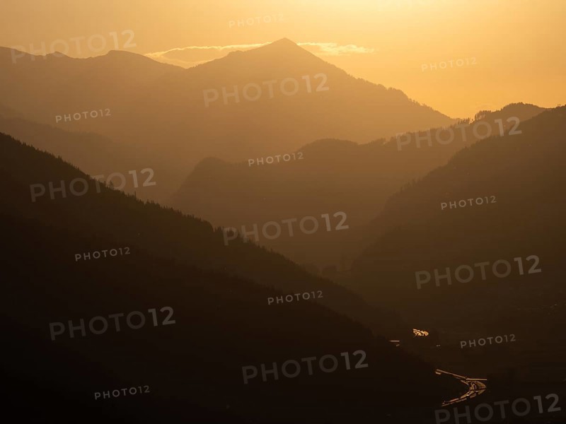 Evening light at sunset over the Liesingtal, in the evening light the village of Traboch, Schoberpass federal road, view from the lowlands, Leoben, Styria, Austria, Europe