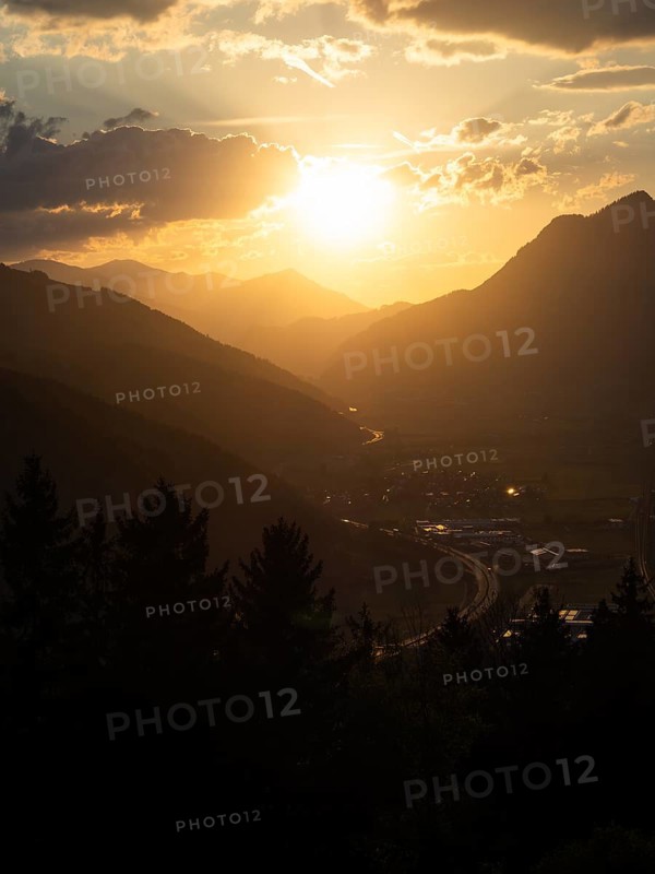 Sunset over the Liesingtal, in the evening light the village of Traboch, Schoberpass federal road, view from the lowlands, Leoben, Styria, Austria, Europe
