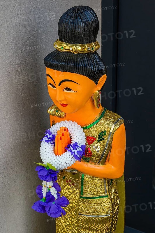 Figure with wreath of flowers at the entrance to the Thai massage parlour, Kaufbeuern, Allgaeu, Swabia, Bavaria, Germany, Europe