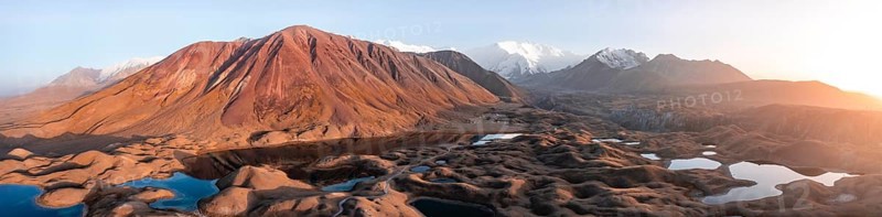 Atmospheric aerial view, high mountain landscape with glacier moraines and mountain lakes, behind Pik Lenin, Trans Alay Mountains, Pamir Mountains, Osher Province, Kyrgyzstan, Asia