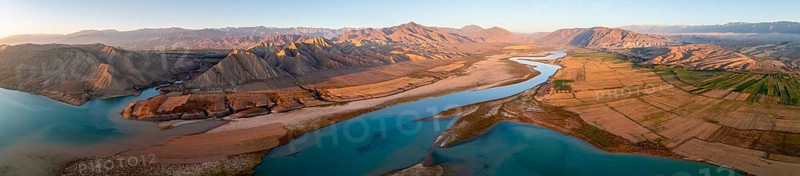 Panorama, Naryn river between mountains and fields, at Toktogul reservoir at sunset, aerial view, Kyrgyzstan, Asia