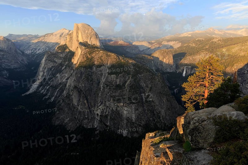 Warm evening light illuminates Half Dome and the surrounding cliffs of Yosemite, Yosemite National Park, North America, USA, South-West, California, California, North America