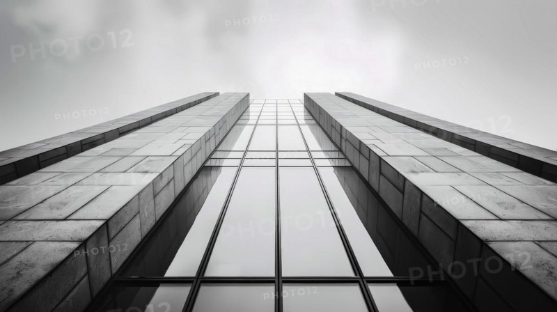 Symmetrical greyscale image viewed from below a modern building, showcasing its geometric design, AI generated