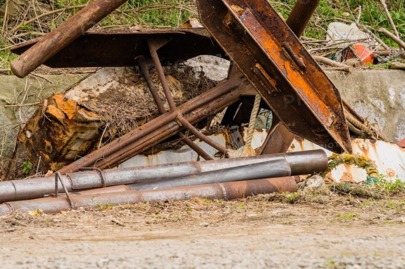 Closeup of large rusted metal anchor used on large fishing vessels in NamHae, South Korea, Asia
