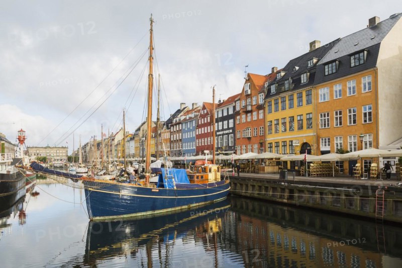 Moored sailboats and colourful 17th century apartment buildings and houses along the Nyhavn canal, Copenhagen, Denmark, Europe