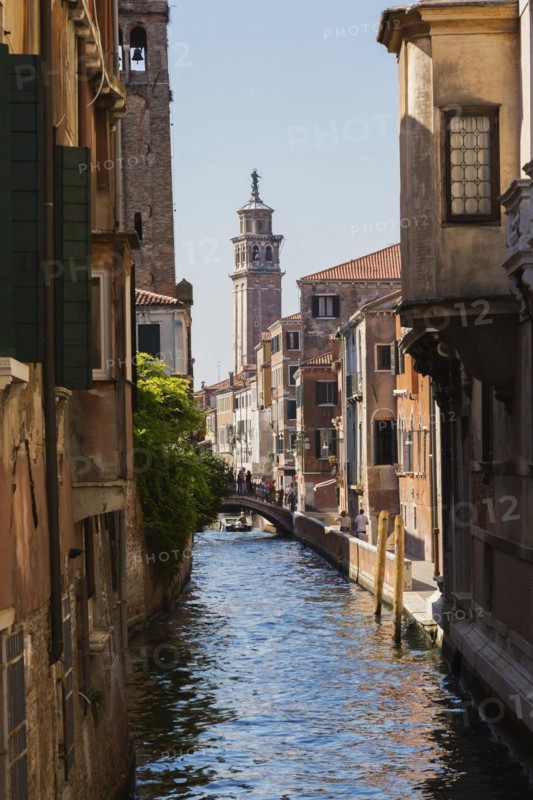 Narrow canal with Renaissance architectural style residential palace buildings, footbridge and church bell tower, Dorsoduro district, Venice, Veneto, Italy, Europe