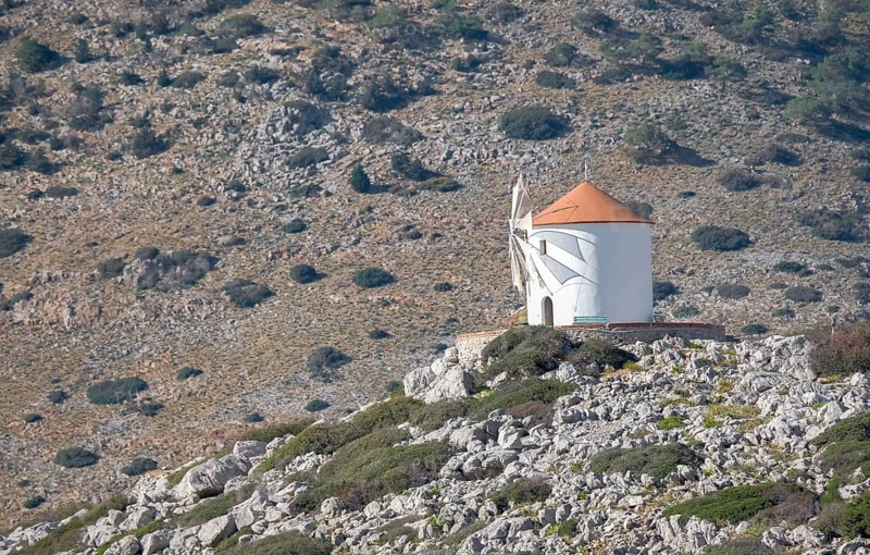 Old windmill on a rock, Beech of Panormitis, Symi, Dodecanese, Greece, Europe