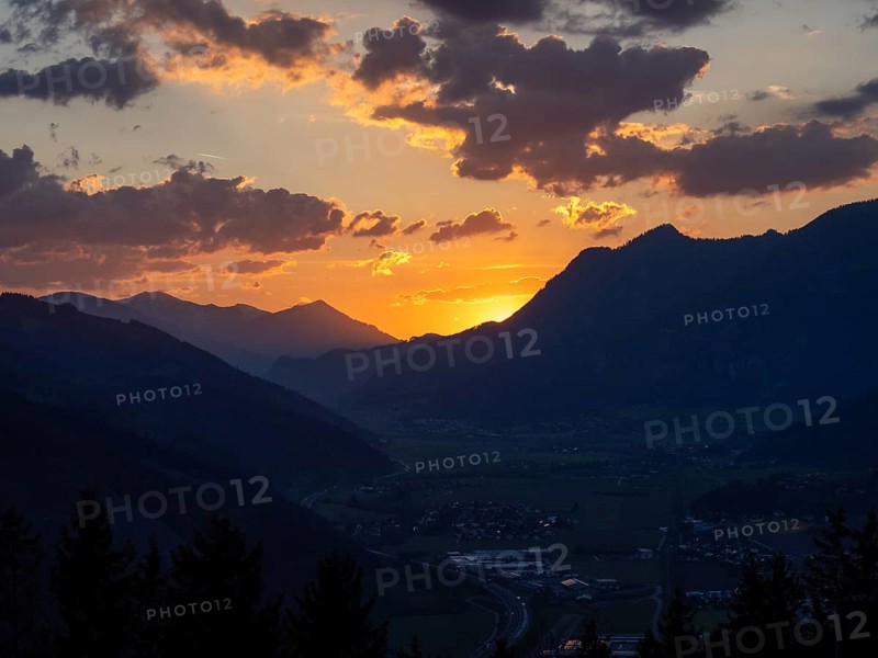 Sunset over the Liesingtal, in the evening light the village of Traboch, Schoberpass federal road, view from the lowlands, Leoben, Styria, Austria, Europe