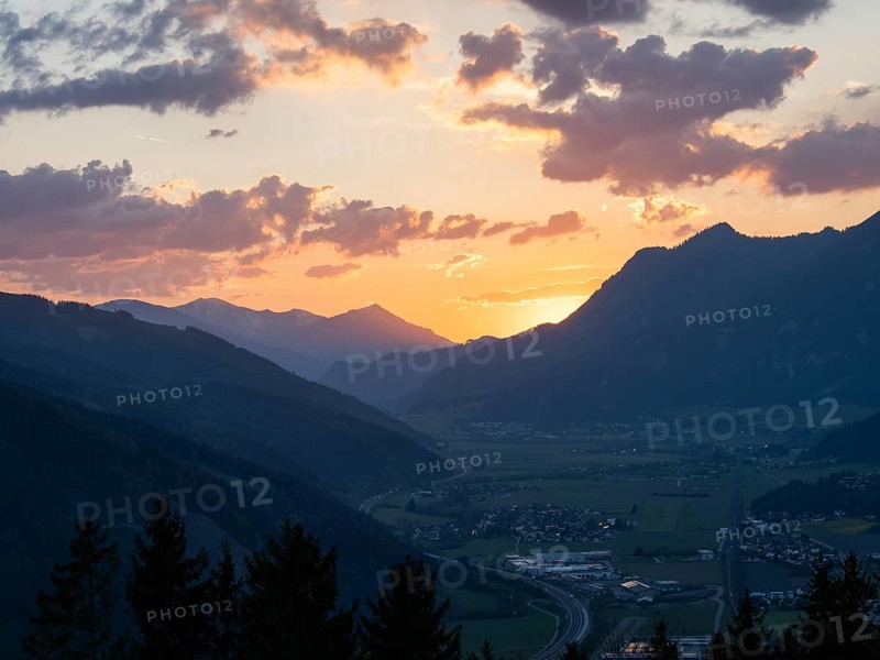 Sunset over the Liesingtal, in the evening light the village of Traboch, Schoberpass federal road, view from the lowlands, Leoben, Styria, Austria, Europe