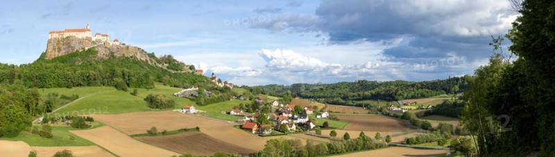 Riegersburg in the evening light, foreground field, panoramic view, cloudy mood, Riegersburg, Styrian volcano country, Styria, Austria, Europe