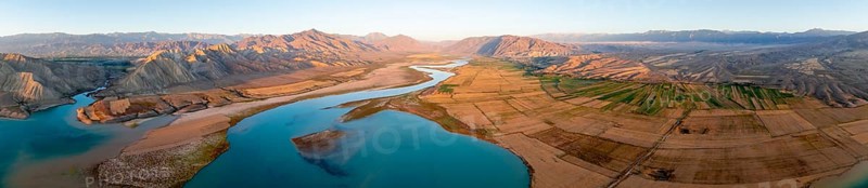 Panorama, Naryn river between mountains and fields, at Toktogul reservoir at sunset, aerial view, Kyrgyzstan, Asia
