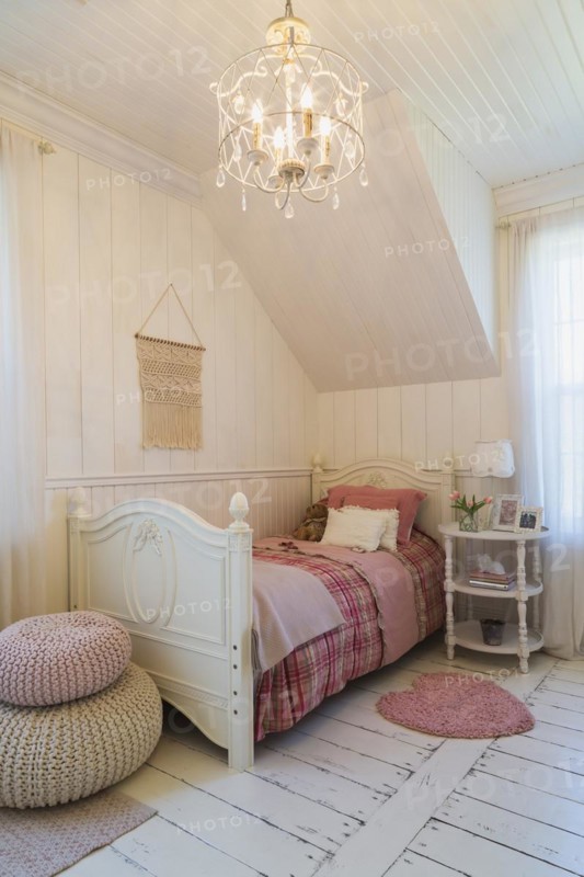Single bed with red, pink and grey tartan bedspread, white painted antique style wooden headboard and footboard, nightstand in a kid's bedroom with white painted larch wood floorboards on upstairs floor inside country style home, Quebec, Canada, North America