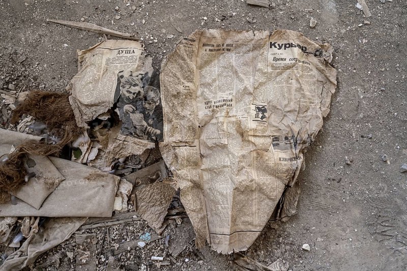 Remains of an old Kyrgyz newspaper from 1924 with Cyrillic writing in an abandoned building, ghost town, Engilchek, Tian Shan, Kyrgyzstan, Asia