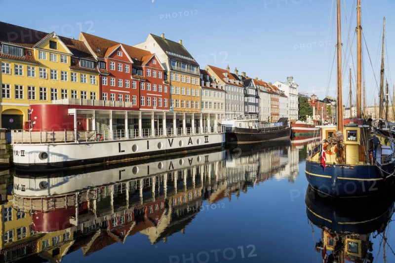 Moored Liva II restaurant boat, ships and colourful 17th century apartment buildings and houses along the Nyhavn canal, Copenhagen, Denmark, Europe