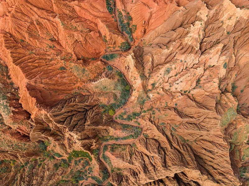 Top Down View, Badlands, river in a gorge with eroded red sandstone rocks, Konorchek Canyon, Boom Gorge, aerial view, Kyrgyzstan, Asia