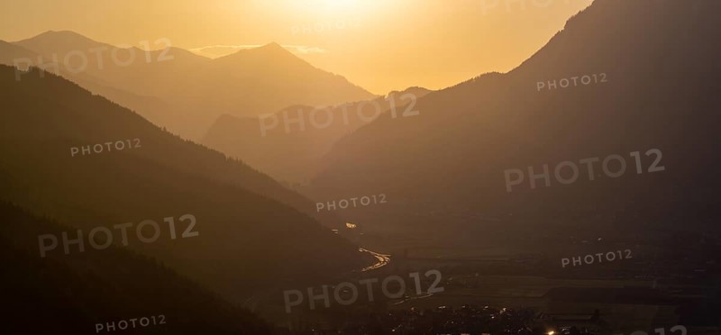 Evening light at sunset over the Liesingtal, in the evening light the village of Traboch, Schoberpass federal road, panoramic shot, view from the lowlands, Leoben, Styria, Austria, Europe