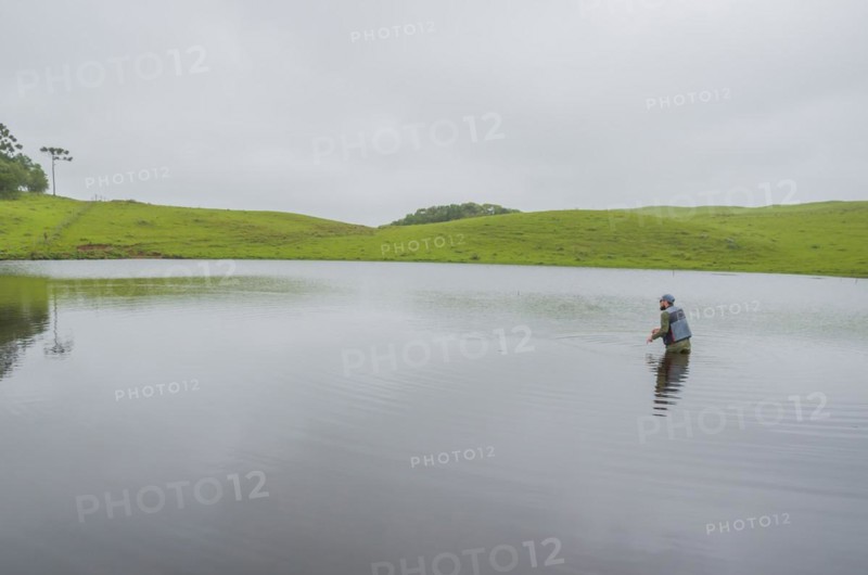 Black bass fisherman fishing with flyfishing, Cambara do sul, Rio Grande do sul, Brazil, South America