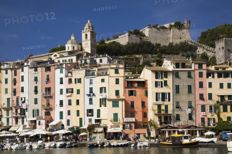 Harbour with fishing boats and colourful apartment building facades at Portovenere, La Spezia province, Italy, Europe