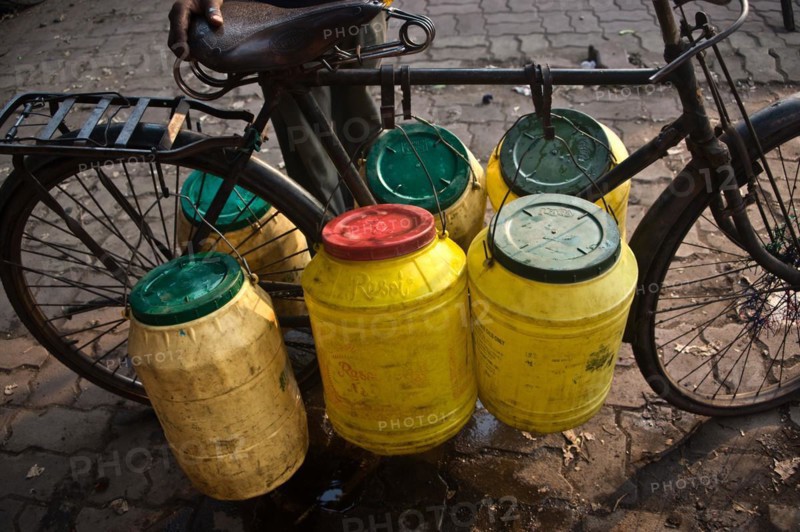 Plastic barrels, water, draw, public water pump, Jharkhand, India, Asia