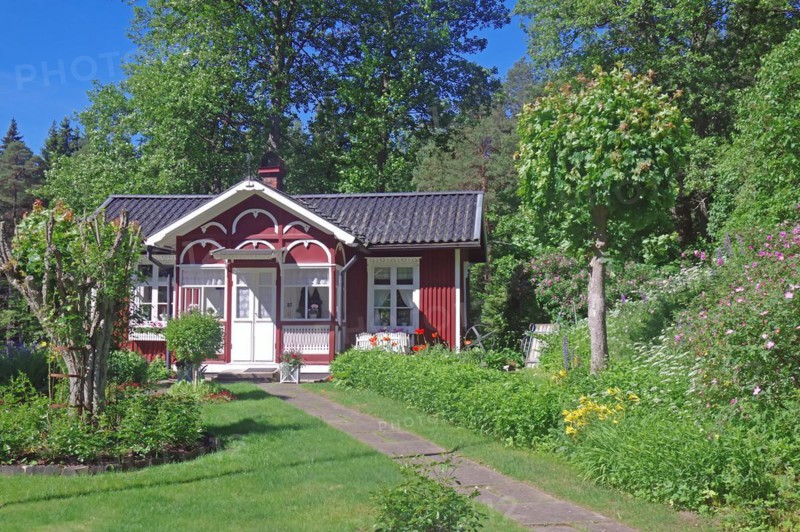 Small red wooden house in a garden, lock keeper's house, waterway, Dalsland Canal, Dalsland, Sweden, Europe