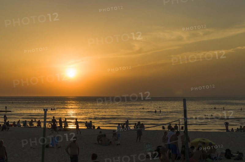 Montevideo, Uruguay, 11th January 2022, Beautiful sunset on Ramires beach with bathers on a summer day in Montevideo Uruguay, South America