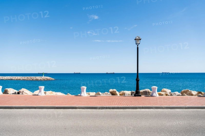 Moll de Llevant waterfront promenade, a 4.5 km long promenade for joggers, walkers, cyclists and skaters at the harbour of Tarragona, Spain, Europe