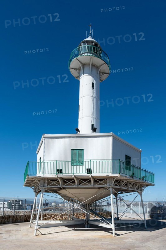 Far de la Banva lighthouse on the Moll de Llevant promenade, a 4.5 km long promenade for joggers, walkers, cyclists and skaters at the harbour of Tarragona, Spain, Europe