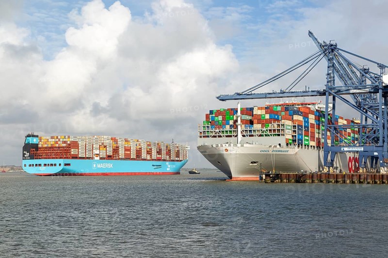 Ane Maersk container ship arriving at Port of Felixstowe, Suffolk, England, UK OOCL Zeebrugge at quayside