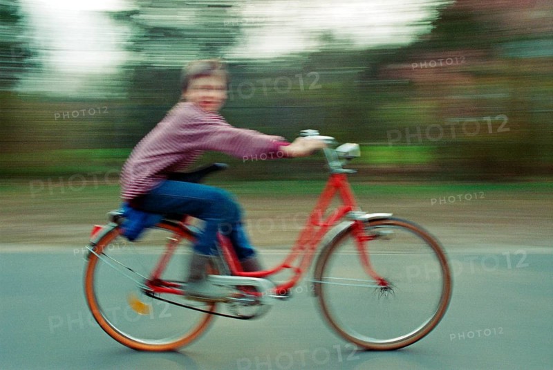 Boy riding bicycle, motion blur, Heiligenthal, Lower Saxony, Germany, 10 April 1992, vintage, retro, old, historical, Europe