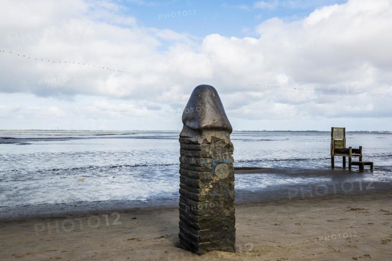 Stone sculpture on the beach and Wadden Sea, penis, artist Eckart Grenzer, Dangast, Jade Bay, North Sea, Lower Saxony, Germany, Europe