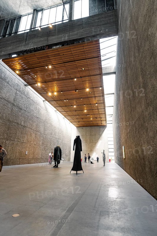 Wide museum hall with concrete walls, wooden ceiling and monumental sculpture, Koenig Galerie, Berlin, Germany, Europe