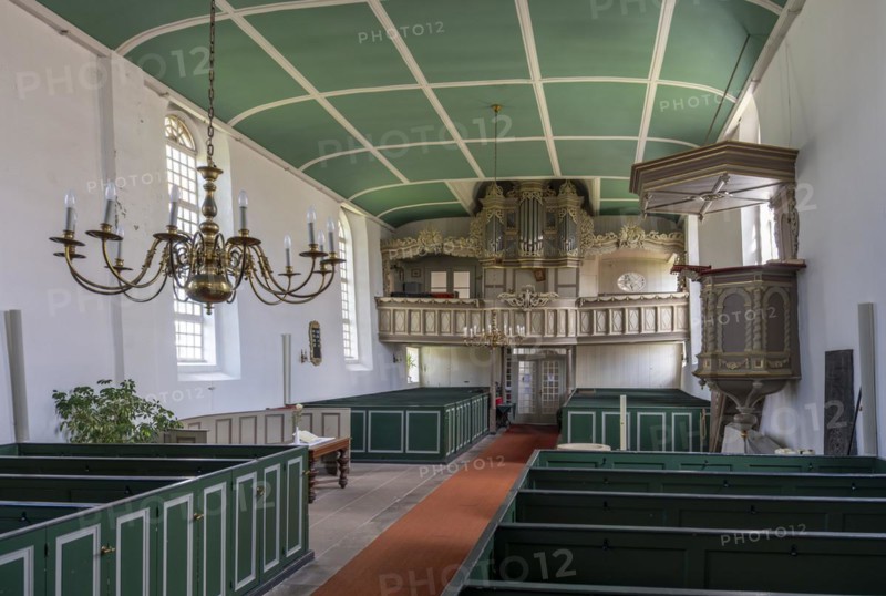 Protestant Reformed Church from 1401, interior with pews, pulpit and organ prospect above the east entrance, Greetsiel, Krummhoern, East Frisia, Lower Saxony, Germany, Europe