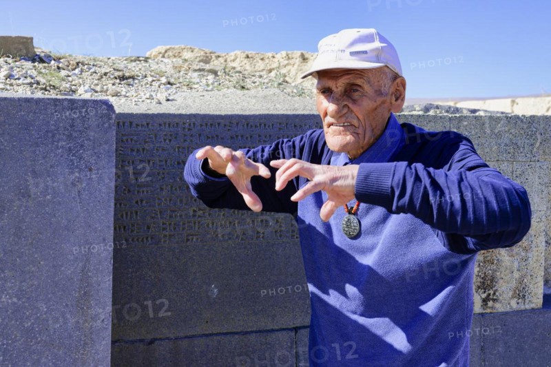 Ruins of the Urartian citadel of Cavustepe, Wardian explaining the cuneiform writing, Van, Turkey, Asia