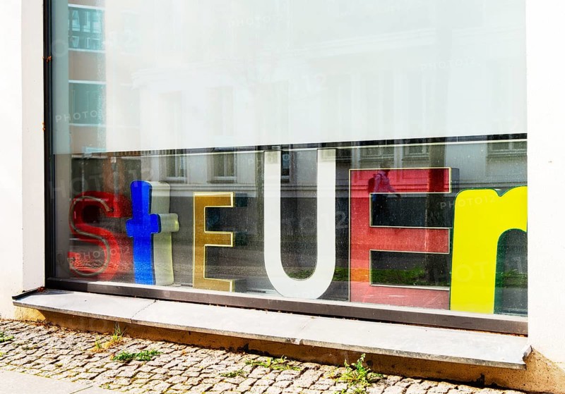 Advertising on the shop window of a tax office, Berlin, Germany, Europe