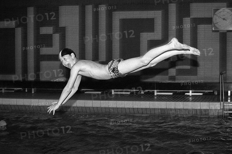 Boy jumps from three-metre board, head dive, indoor swimming pool, Bamberg, Upper Franconia, Bavaria, Germany, 16 October 1987, vintage, retro, old, historical, funny, Europe