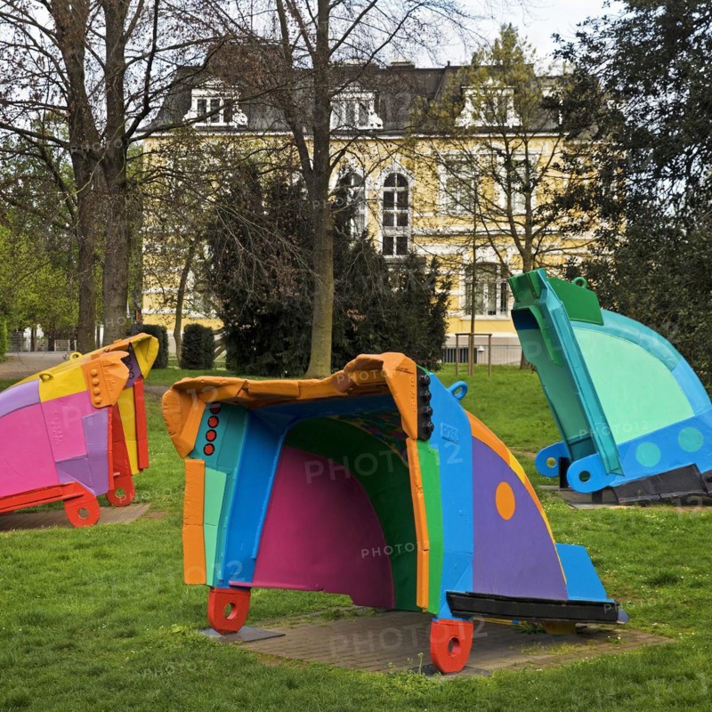 Painted excavator shovels in the municipal park in front of Villa Erckens, artist Guenther Cremers, Grevenbroich, Lower Rhine, North Rhine-Westphalia, Germany, Europe