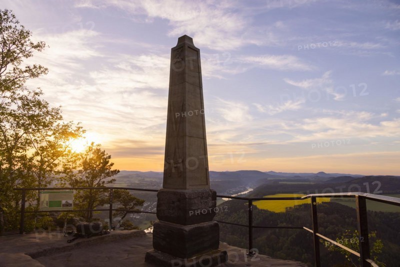 Sunrise on the Lilienstein. The Lilienstein is the most striking and best-known rock in the Elbe Sandstone Mountains. The Wettin obelisk on the highest point of the Lilienstein table mountain (415 metres) in the Saxon Switzerland National Park in Saxony. The 16-metre-high obelisk was erected in 1889 by the Saxon Switzerland Mountain Association in honour of the 800th anniversary of the Wettin dynasty, Ebenheit, Saxony, Germany, Europe